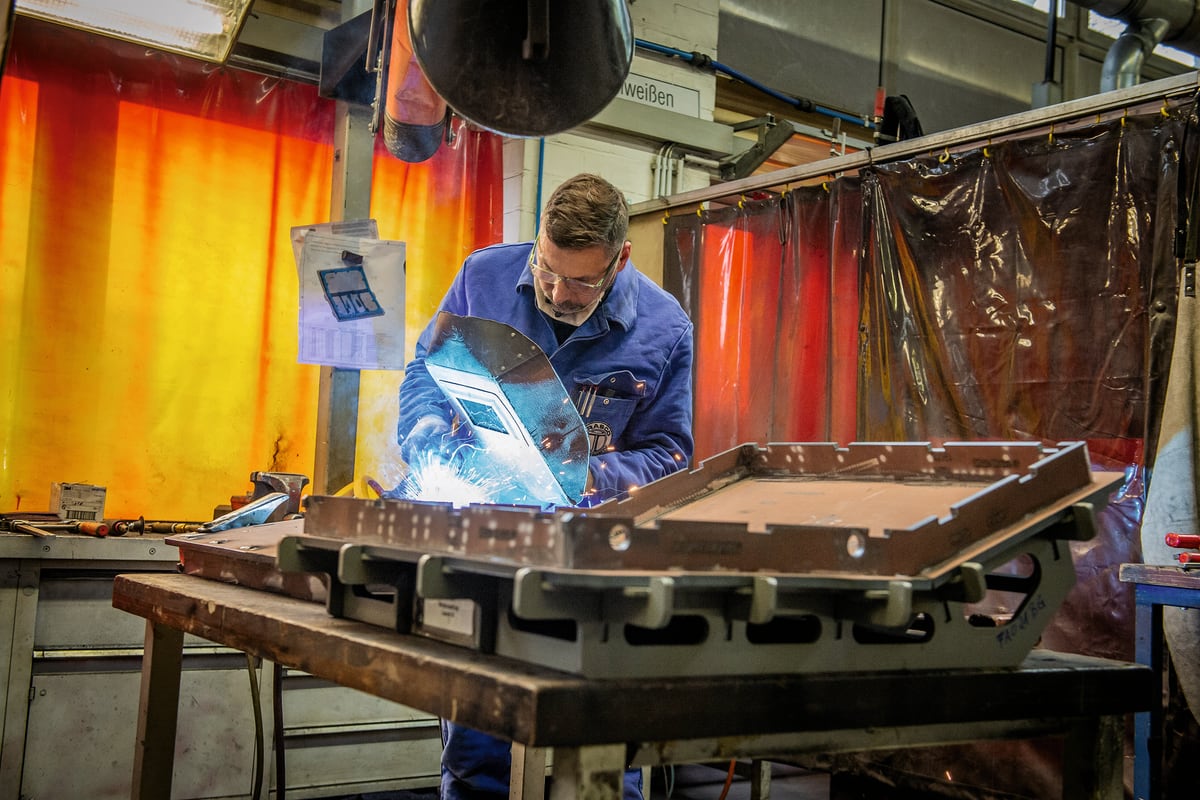 TRASCO steel worker welding an armor frame