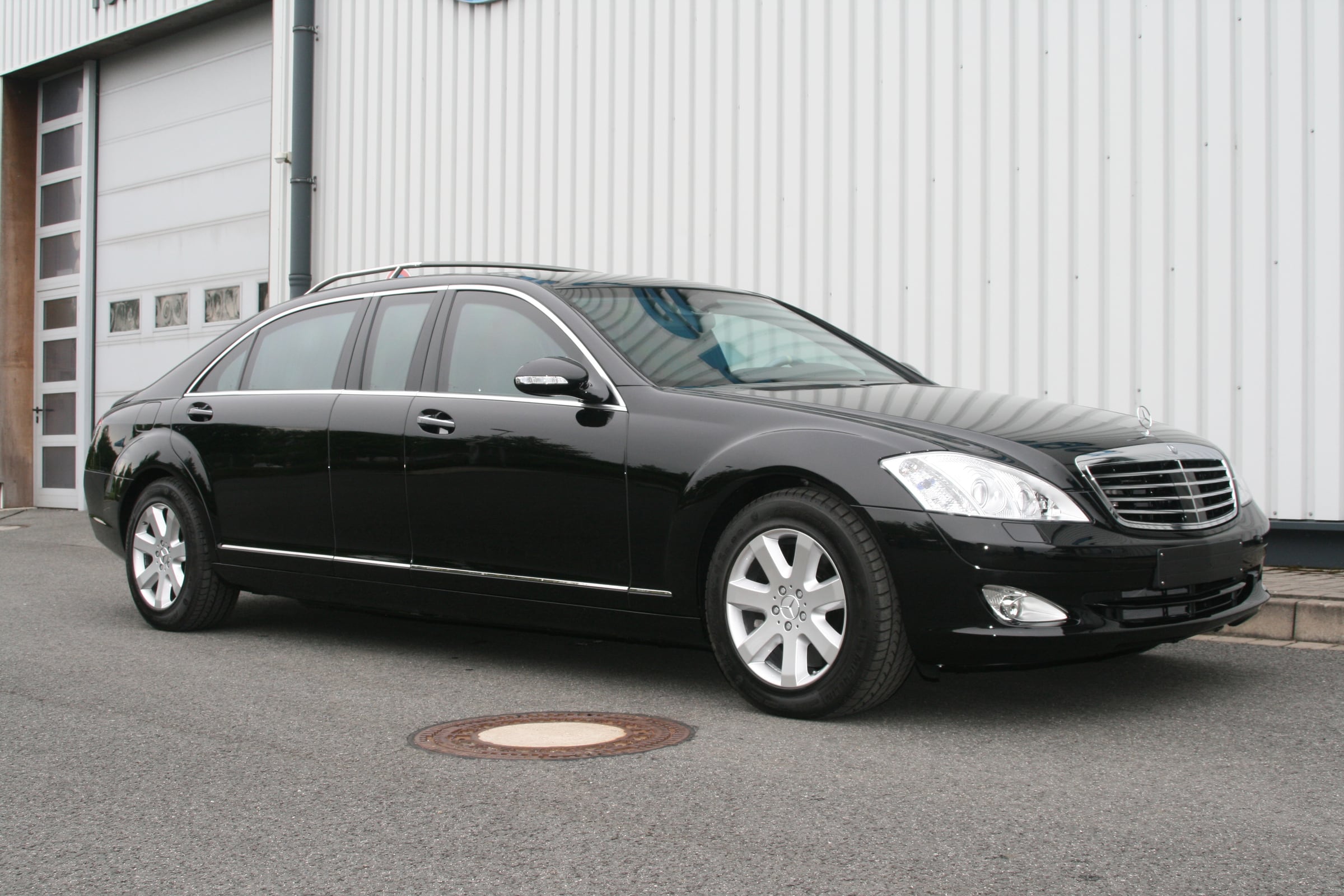 Limousine based on the Mercedes-Benz S-Class W221 with parade roof rail, front three-quarter view