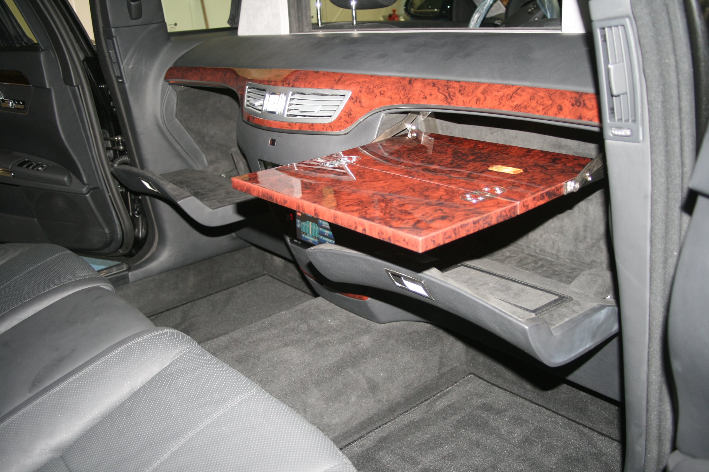 Folding table in wood veneer in the rear of a limousine based on the Mercedes-Benz S-Class W221