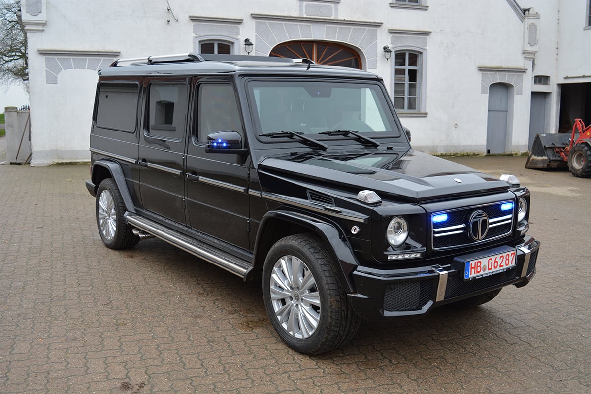 TRASCO VIP SUV XXLong based on the previous Mercedes-Benz G-Class generation, with blue strobe lights in the grille