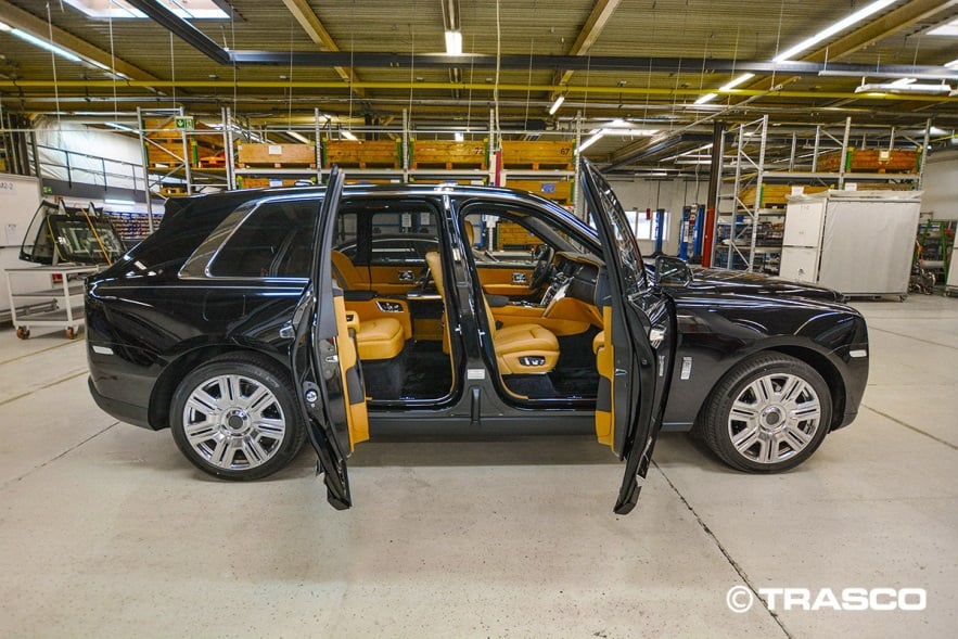 Armored SUV based on the Rolls-Royce Cullinan with all doors open in the TRASCO production hall